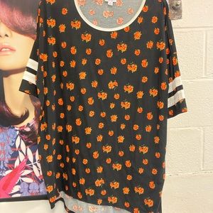 Medium Randy orange floral pattern on black background